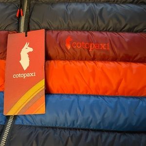 Brand new cotapaxi vest with tags multi colored.